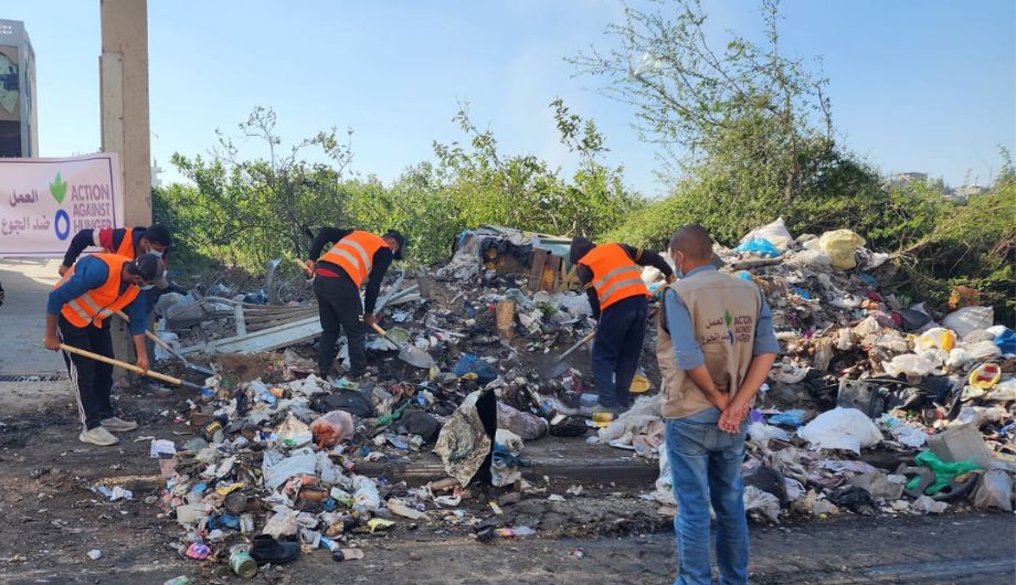 Action Against Hunger team cleaning up debris in Gaza.